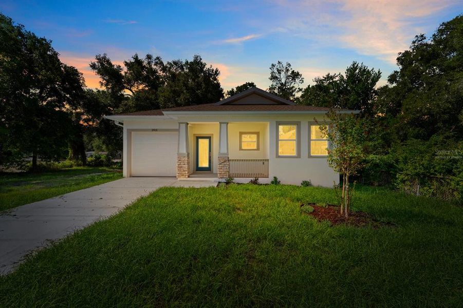 Front exterior of a new home in , Tampa, FL, highlighting curb appeal (Image 1). Front exterior of a new home in , Tampa, FL, highlighting curb appeal (Image 1).