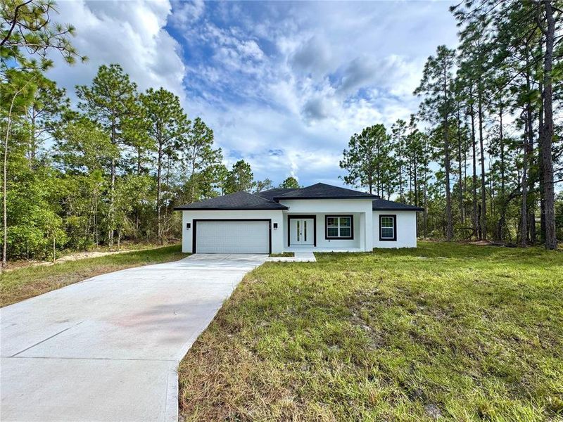 Front exterior of a new home in , Citrus Springs, FL, highlighting curb appeal (Image 19).