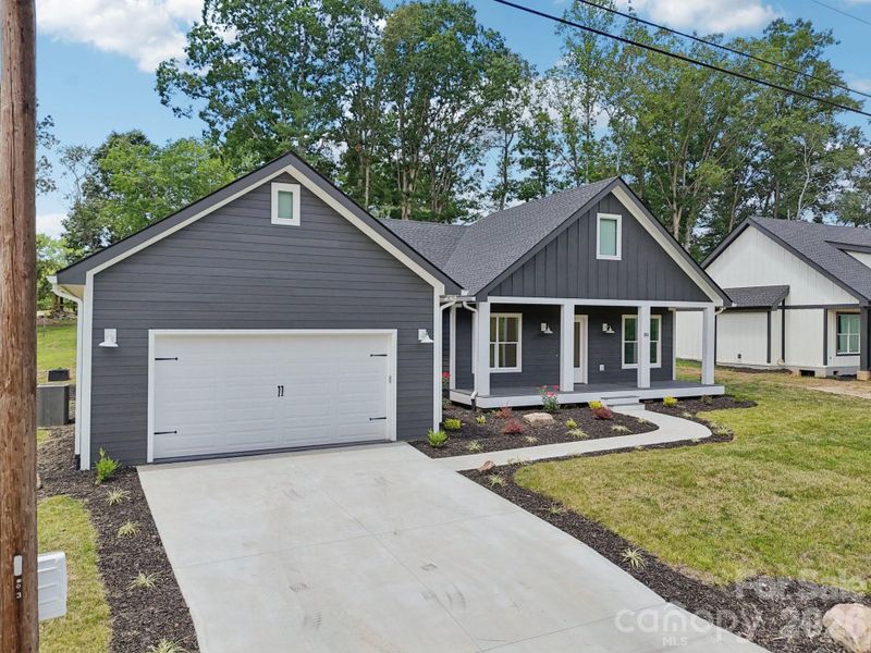 Front exterior of a new home in , Hendersonville, NC, highlighting curb appeal (Image 26).
