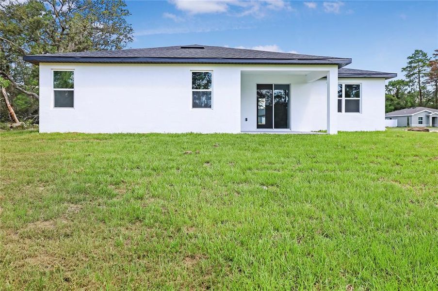 Front exterior of a new home in , Ocala, FL, highlighting curb appeal (Image 13).