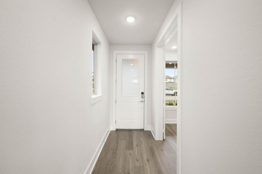 Spacious, unfurnished interior of a new home in Cottage Collection at Harvest, Argyle (Image 11).