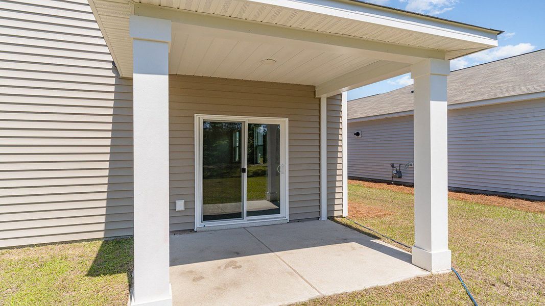 Representative exterior photo of a completed home built from the ROBIE by D.R. Horton in Sandridge Park, Little River, SC (Image 18).