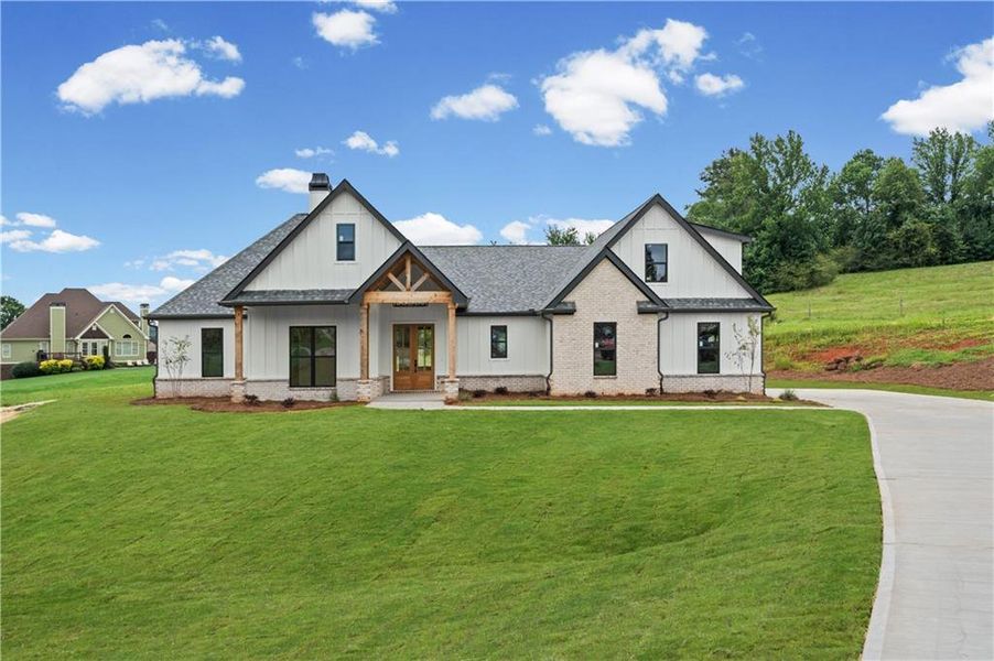 Front exterior of a new home in , Clermont, GA, highlighting curb appeal (Image 30). Front exterior of a new home in , Clermont, GA, highlighting curb appeal (Image 30).