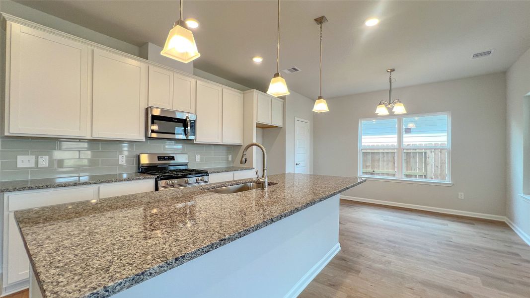 The Brambling- Kitchen. Sample floor plan image for illustration; upgrades, options, and colors may vary.