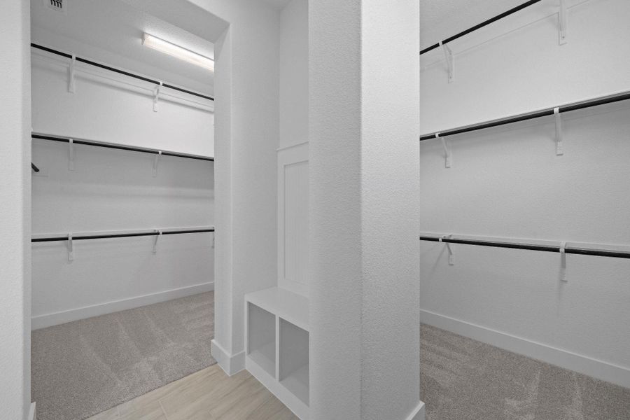 Walk-in closet in Primary Bedroom Walk-in closet in Primary Bedroom
