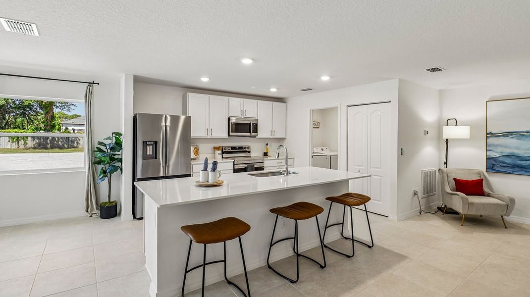 Representative furnished interior of a home built from the Marigold by Maronda Homes in Vero Lake Estates, Vero Beach (Image 9).