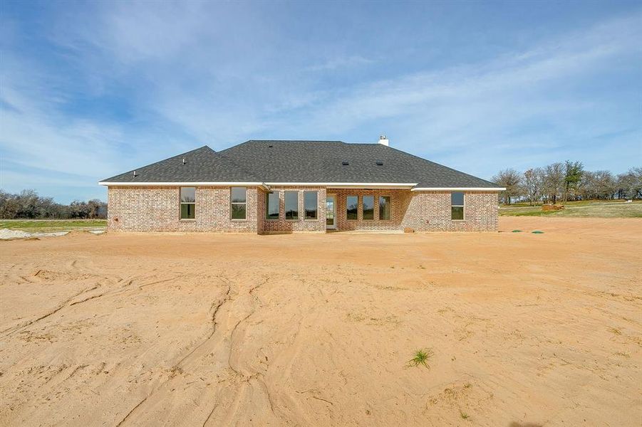 Exterior details and patio area of a home in , Poolville (Image 4).