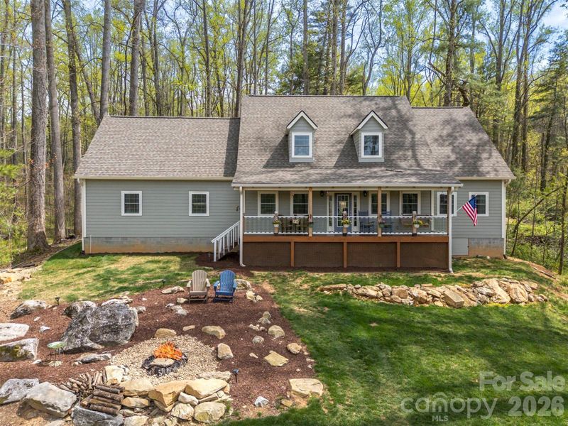 Fire pit area in the front yard-perfect for enjoying quiet evenings under the stars. Fire pit area in the front yard-perfect for enjoying quiet evenings under the stars.
