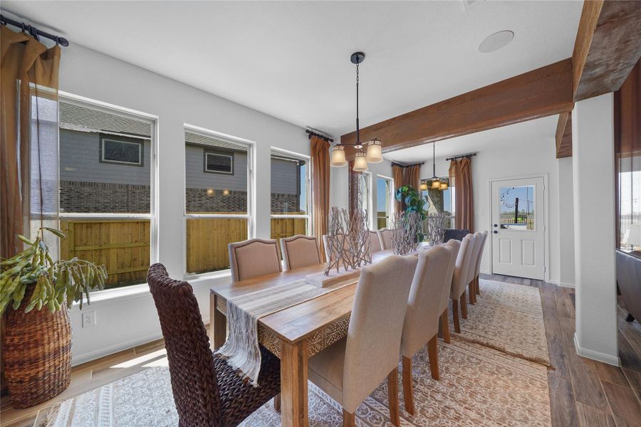 Sun-lit dining area and sunroom (*Photo not of actual home and used for illustration purposes only.)