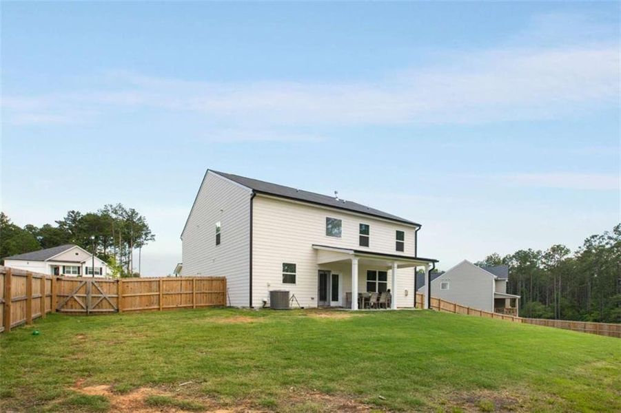 Front exterior of a new home in Stillwater Springs, Dacula, GA, highlighting curb appeal (Image 24). Front exterior of a new home in Stillwater Springs, Dacula, GA, highlighting curb appeal (Image 24).