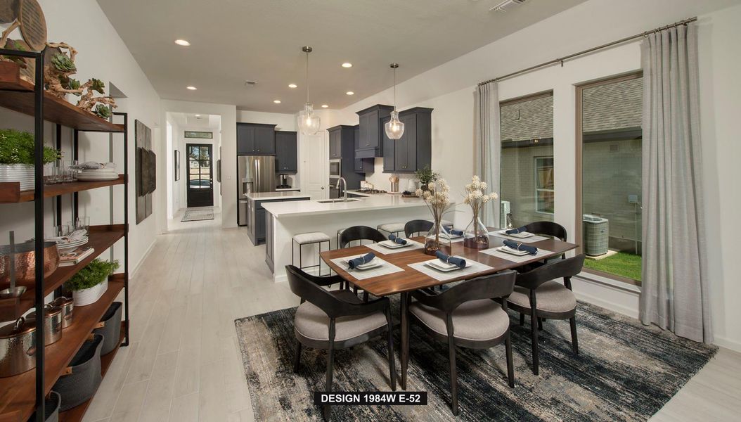 Dining space with recessed lighting and light wood finished floors