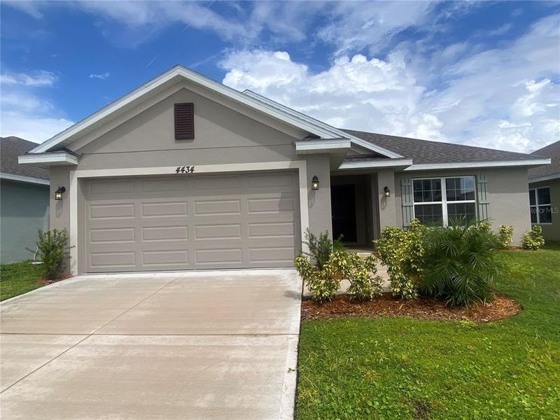 Front exterior of a new home in , Harmony, FL, highlighting curb appeal (Image 1). Front exterior of a new home in , Harmony, FL, highlighting curb appeal (Image 1).