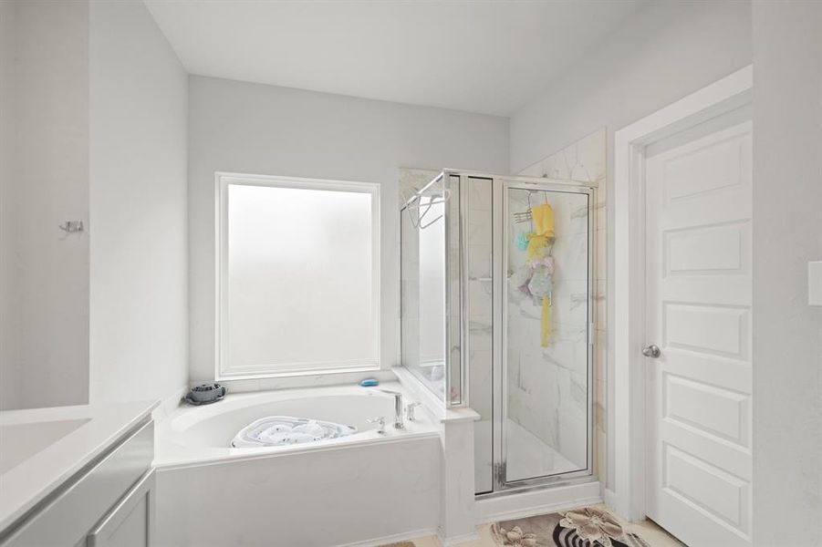 Relax in your deep soaking tub or opt for a quick rinse in the separate shower.
