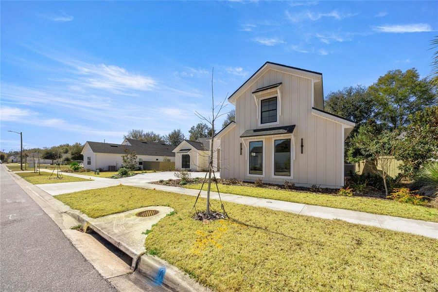 Front exterior of a new home in , Gainesville, FL, highlighting curb appeal (Image 1). Front exterior of a new home in , Gainesville, FL, highlighting curb appeal (Image 1).