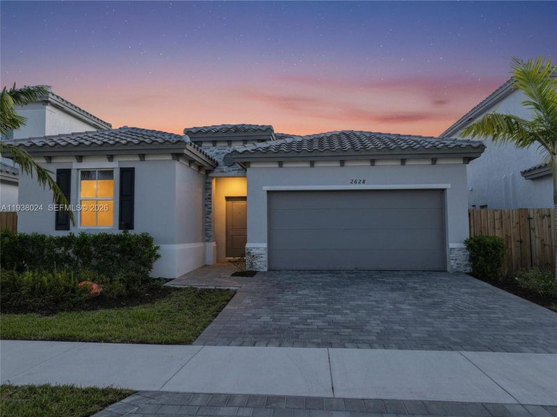 Front exterior of a new home in , Homestead, FL, highlighting curb appeal (Image 2). Front exterior of a new home in , Homestead, FL, highlighting curb appeal (Image 2).