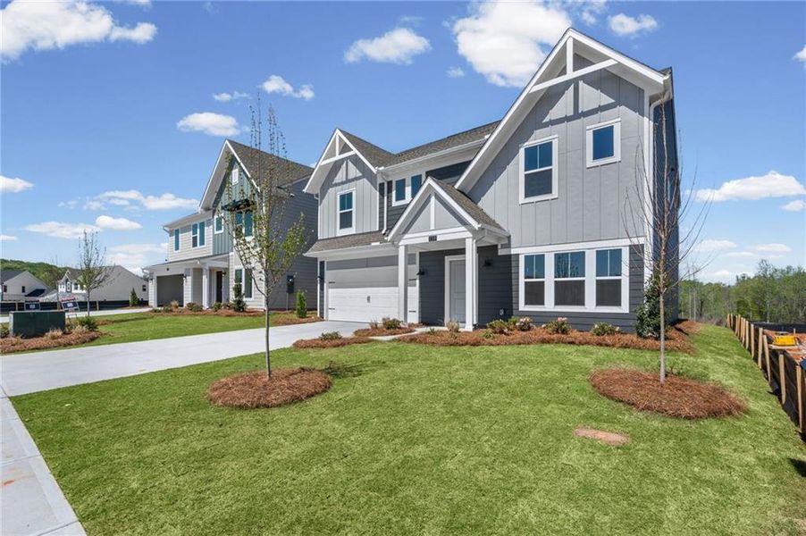 Front exterior of a new home in Twin Lakes, Hoschton, GA, highlighting curb appeal (Image 24).