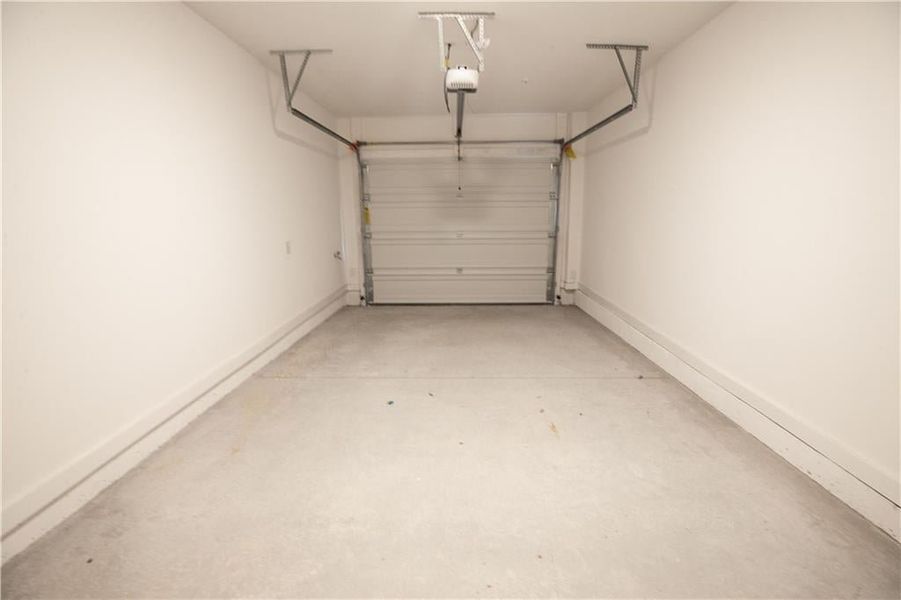 Spacious garage with added additional depth for overhead storage + Electric Vehicle Outlet for Charging