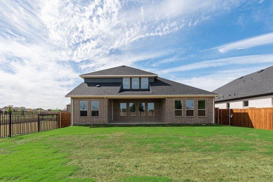 Exterior details and patio area of a home in Villages of Creekwood, Frisco (Image 4).
