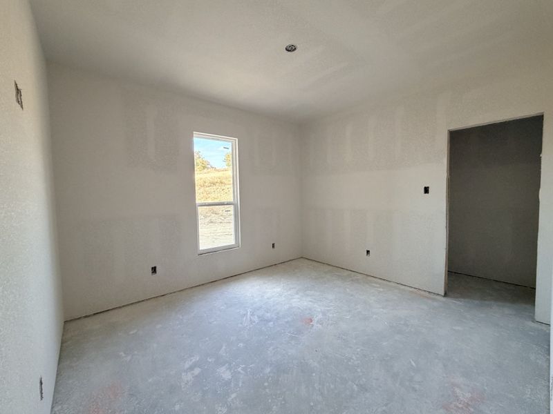 In-progress construction of a new home in Saddle Crest Estates, Weatherford, TX (Image 28).