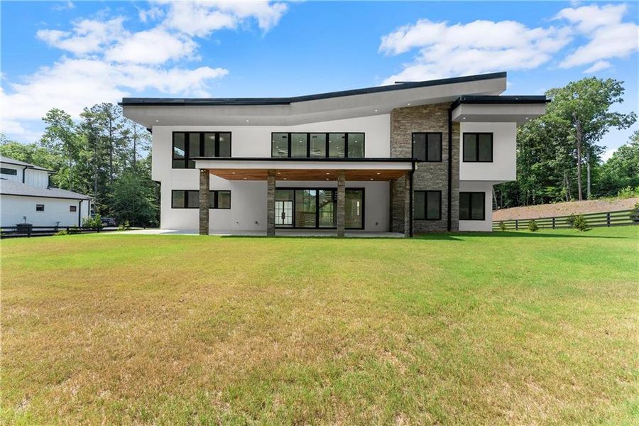 Front exterior of a new home in , Hoschton, GA, highlighting curb appeal (Image 22).