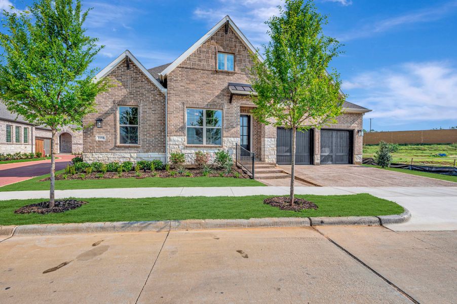 Front exterior of a new home in Elements at Viridian - Garden Series, Arlington, TX, highlighting curb appeal (Image 2). Front exterior of a new home in Elements at Viridian - Garden Series, Arlington, TX, highlighting curb appeal (Image 2).