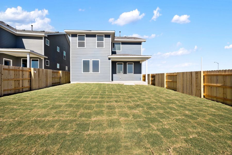 Exterior details and patio area of a home in The Homestead at Lariat, Liberty Hill (Image 32).