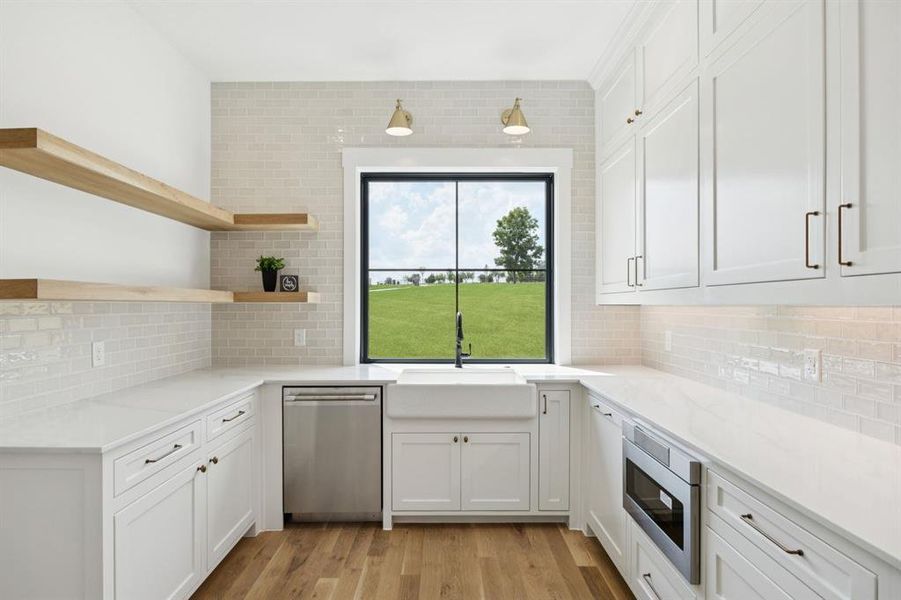 Full catering kitchen with ice maker, dishwasher and microwave for effortless entertaining. Don't miss the over-sized walk-in pantry. Full catering kitchen with ice maker, dishwasher and microwave for effortless entertaining. Don't miss the over-sized walk-in pantry.