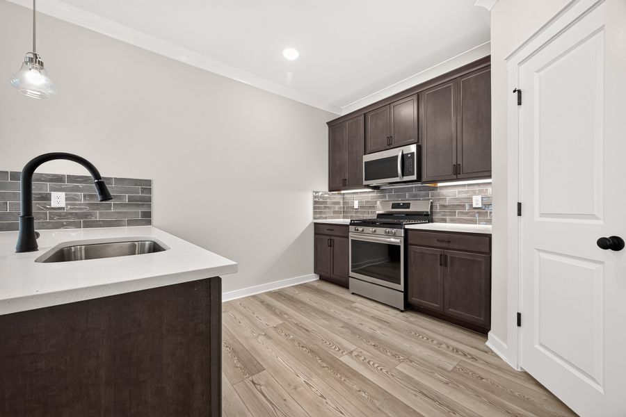Furnished interior view inside a new home in Aldeana, Bonney (Image 11).
