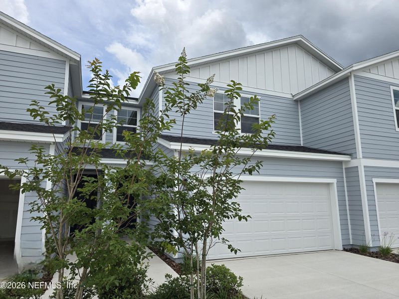 Front exterior of a new home in , Middleburg, FL, highlighting curb appeal (Image 1). Front exterior of a new home in , Middleburg, FL, highlighting curb appeal (Image 1).