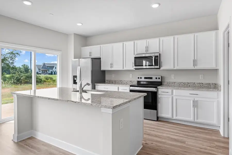 A kitchen with white cabinets. A kitchen with white cabinets.