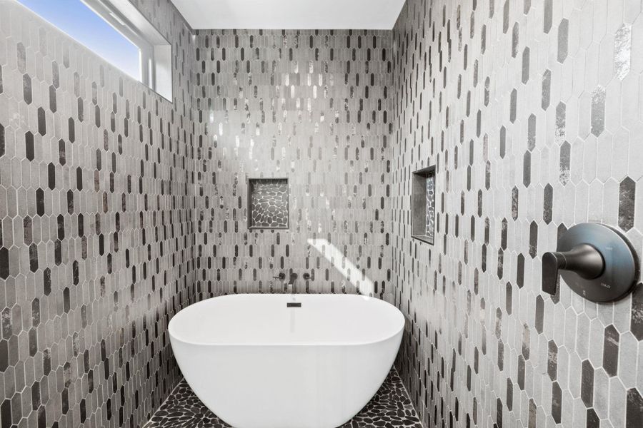 Spacious walk-in hower and tub at primary bathroom