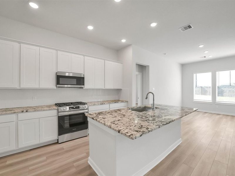 Furnished interior view inside a new home in Sunterra, Katy (Image 6).