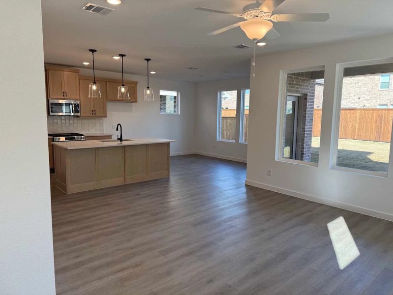 Open Kitchen-Living-Dining Room Construction Progress featuring the Artisan Collection