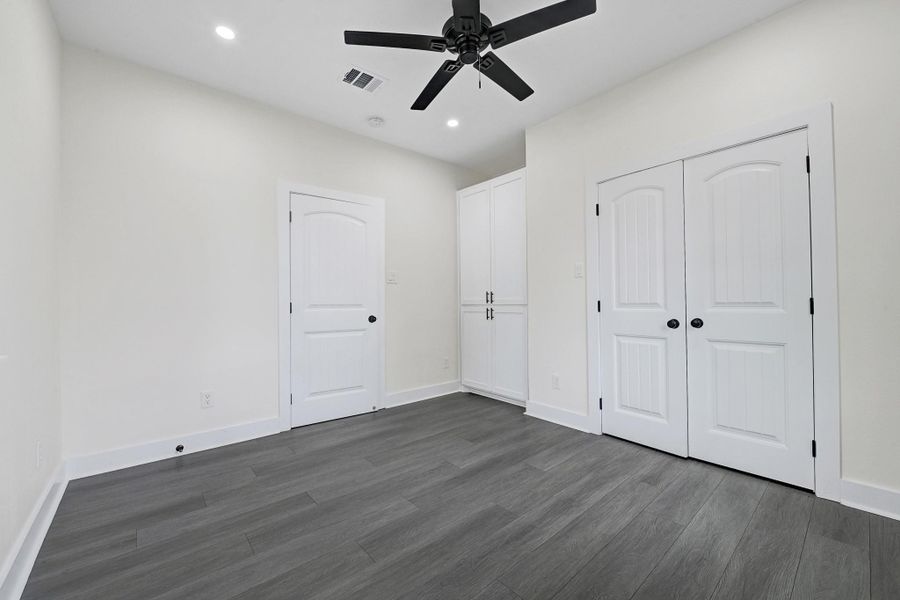 Spacious second bedroom featuring sleek flooring. Spacious second bedroom featuring sleek flooring.