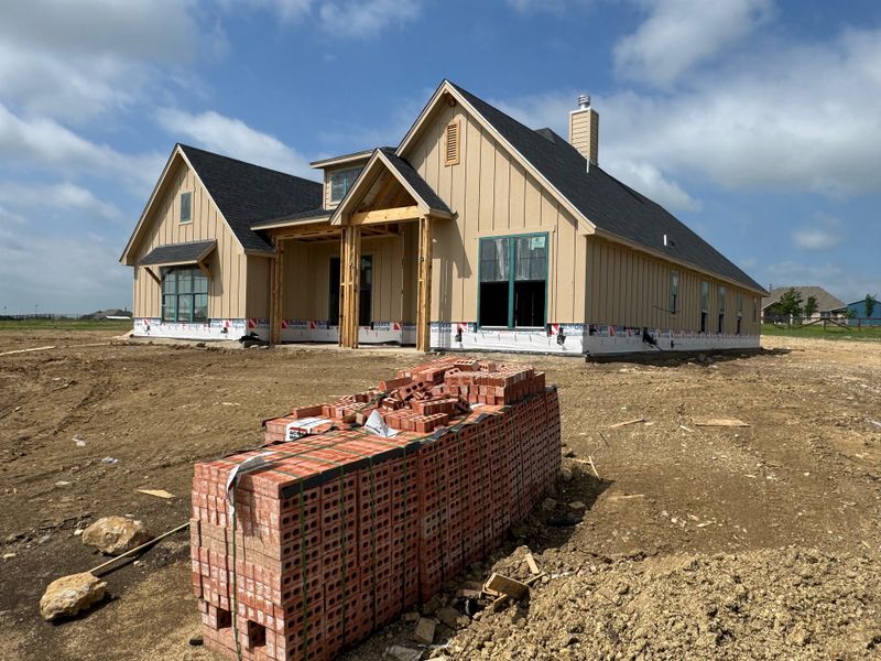 Front exterior of a new home in Paloma Ranches, New Fairview, TX, highlighting curb appeal (Image 2).