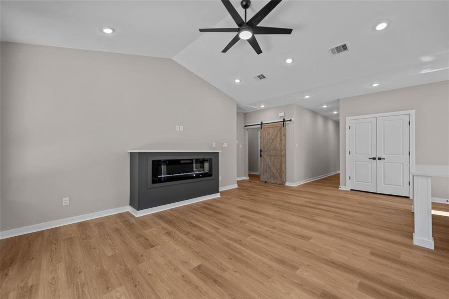 High ceilings and utility/laundry room has its own barndoor, this also leads to the garage.