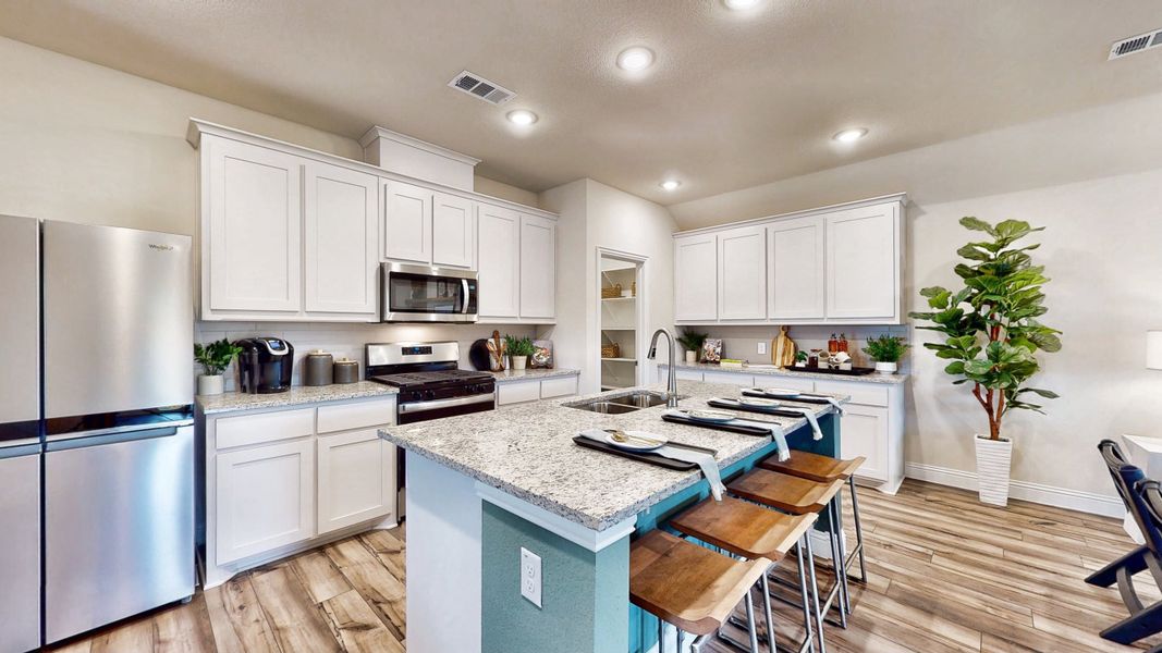 A kitchen with white cabinets. A kitchen with white cabinets.