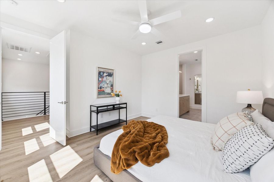 The primary bedroom is generously sized with ample space for a dresser versus the table pictured here. Again these stunning floors are standard, nothing to upgrade. The primary bedroom is generously sized with ample space for a dresser versus the table pictured here. Again these stunning floors are standard, nothing to upgrade.