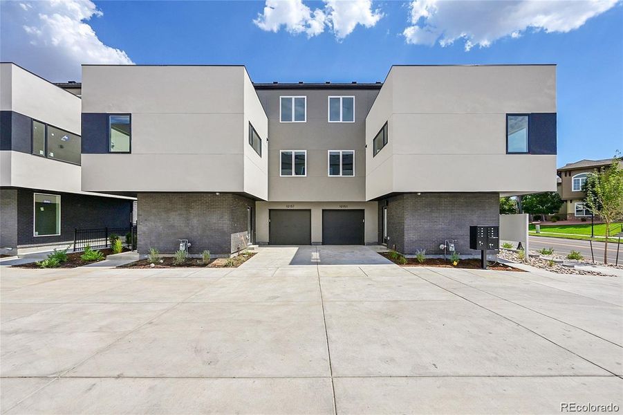 Attached garage and extra parking space in personal driveway. Unit 10151 is on the right.