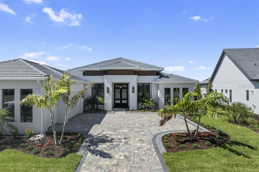 Front exterior of a new home in , Venice, FL, highlighting curb appeal (Image 1). Front exterior of a new home in , Venice, FL, highlighting curb appeal (Image 1).