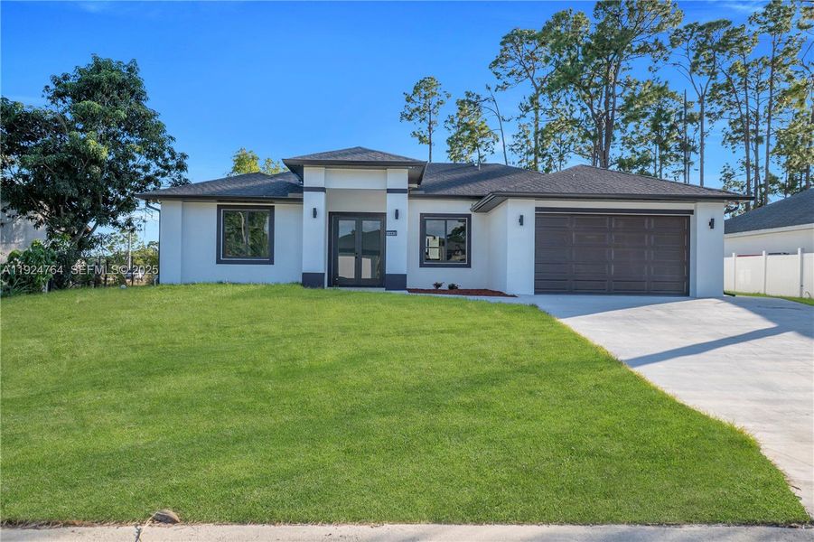 Front exterior of a new home in , Lehigh Acres, FL, highlighting curb appeal (Image 2).