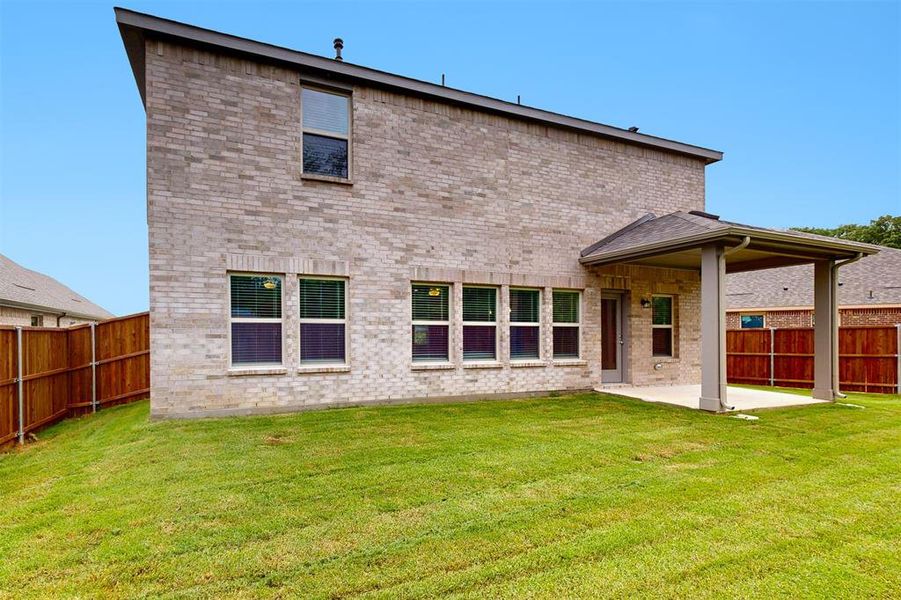 Front exterior of a new home in Kings Way, Denton, TX, highlighting curb appeal (Image 2). Front exterior of a new home in Kings Way, Denton, TX, highlighting curb appeal (Image 2).