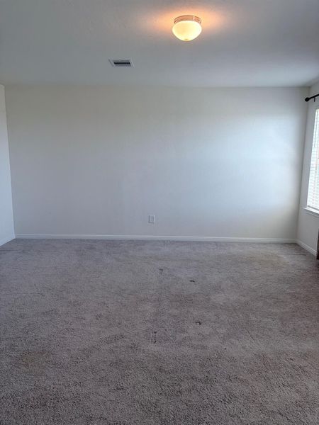 Spacious, unfurnished interior of a new home in Sunterra, Katy (Image 15).