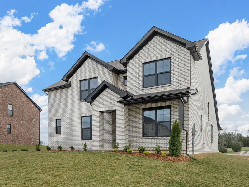 Front exterior of a new home in Benders Cove, Mount Juliet, TN, highlighting curb appeal (Image 2). Front exterior of a new home in Benders Cove, Mount Juliet, TN, highlighting curb appeal (Image 2).
