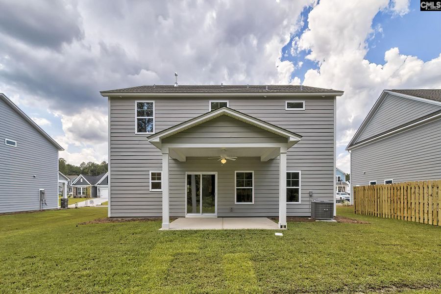 Exterior details and patio area of a home in Cottages at Roofs Pond, West Columbia (Image 2).
