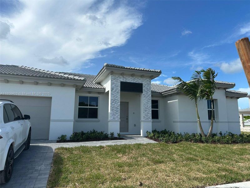 Front exterior of a new home in Hawthorne at Galiano Pointe, Miami, FL, highlighting curb appeal (Image 2).