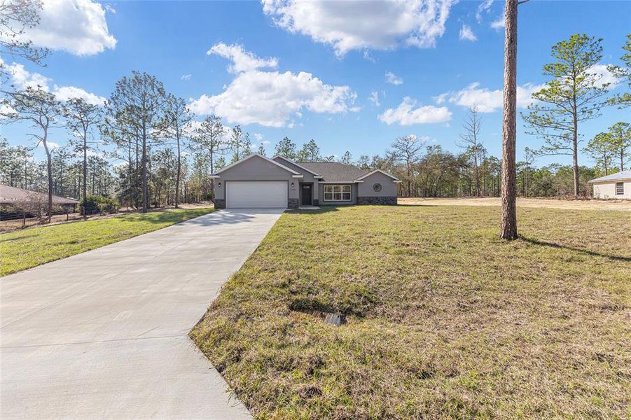 Front exterior of a new home in , Ocala, FL, highlighting curb appeal (Image 2). Front exterior of a new home in , Ocala, FL, highlighting curb appeal (Image 2).