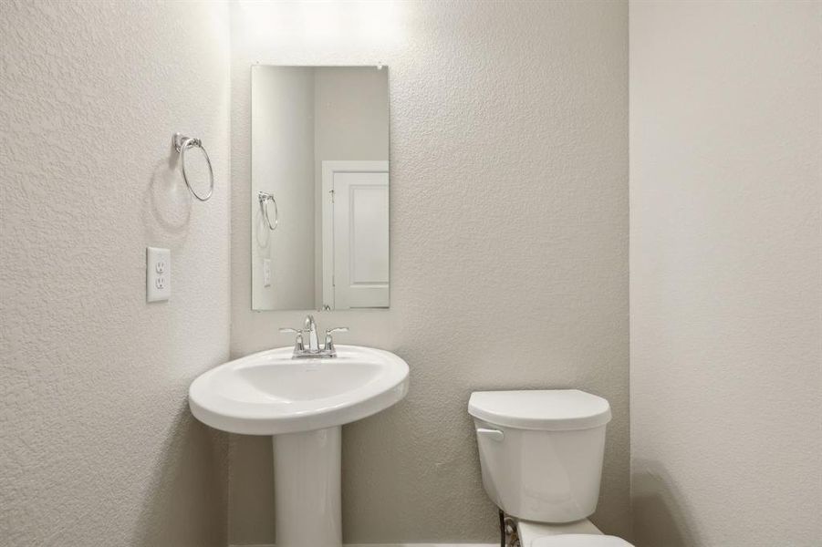 Bathroom featuring sink and toilet