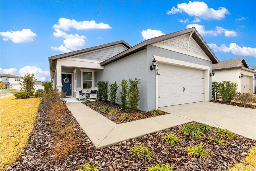 Front exterior of a new home in Pioneer Ranch, Ocala, FL, highlighting curb appeal (Image 23).