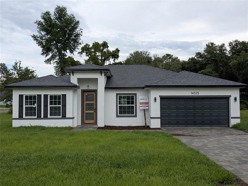 Front exterior of a new home in , Ocala, FL, highlighting curb appeal (Image 2).